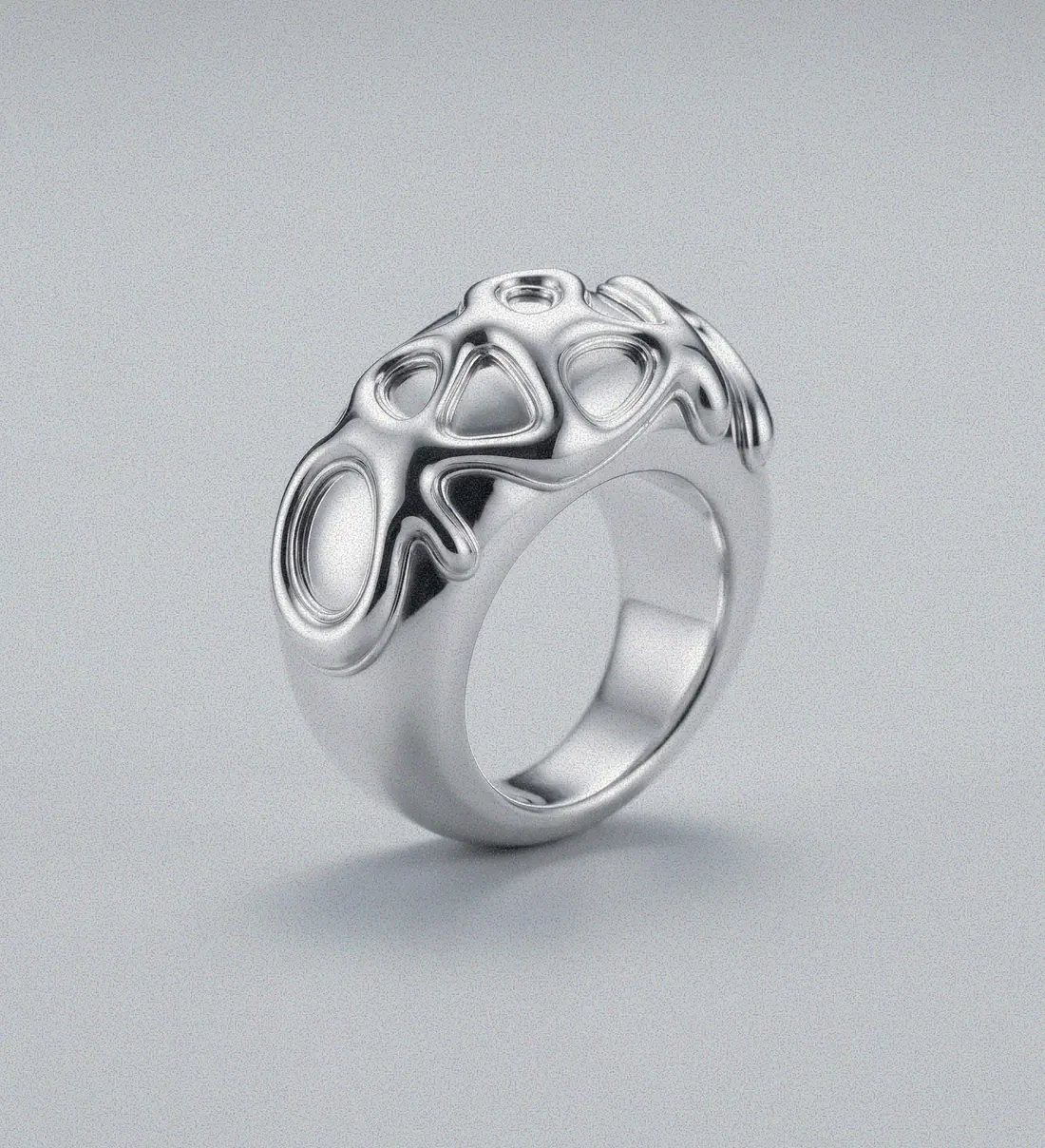 The Flux ring, a domed silver band with the ORBIT wordmark worn into it